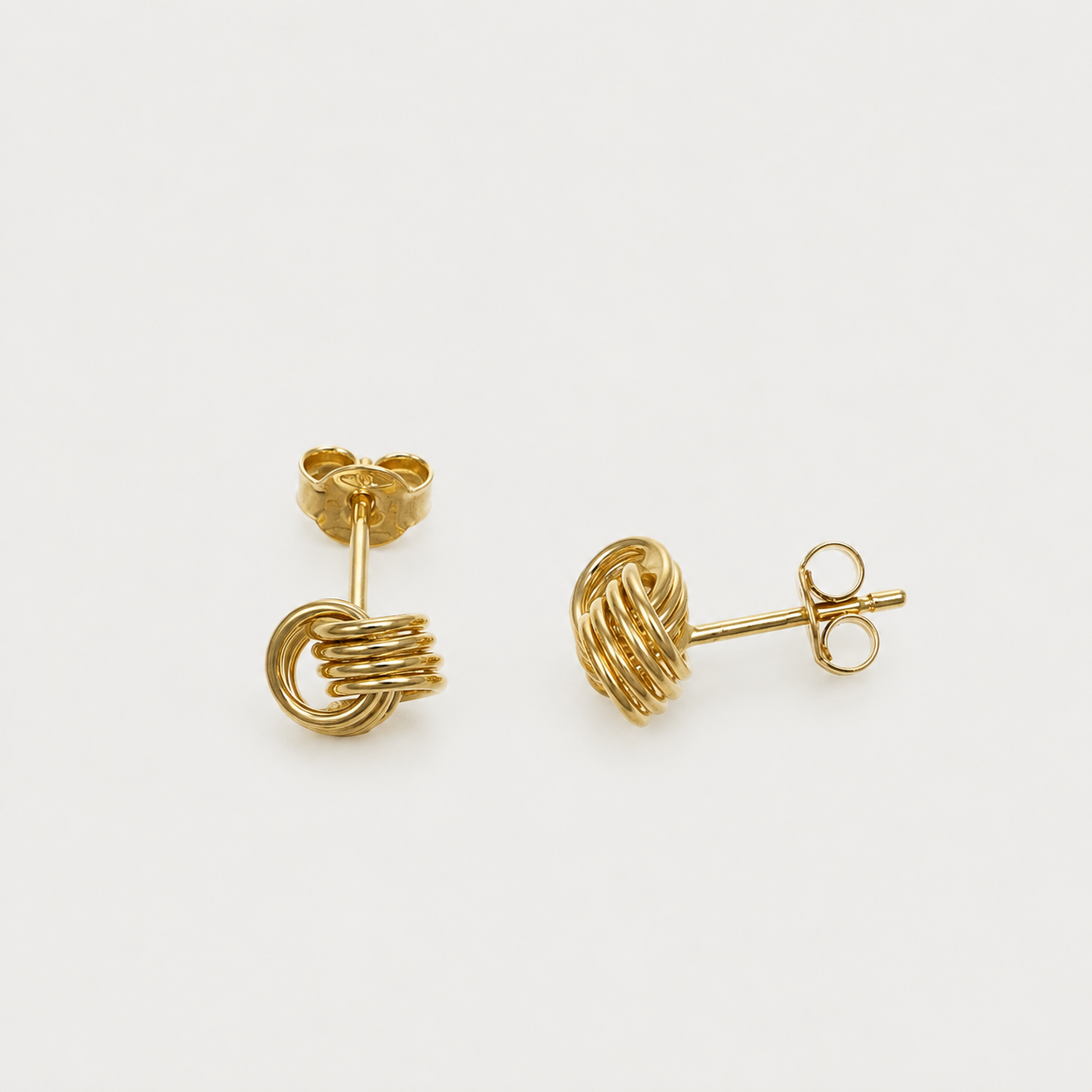 GDG Jewels orecchini lobo nodo in oro giallo dal design lucido e bombato